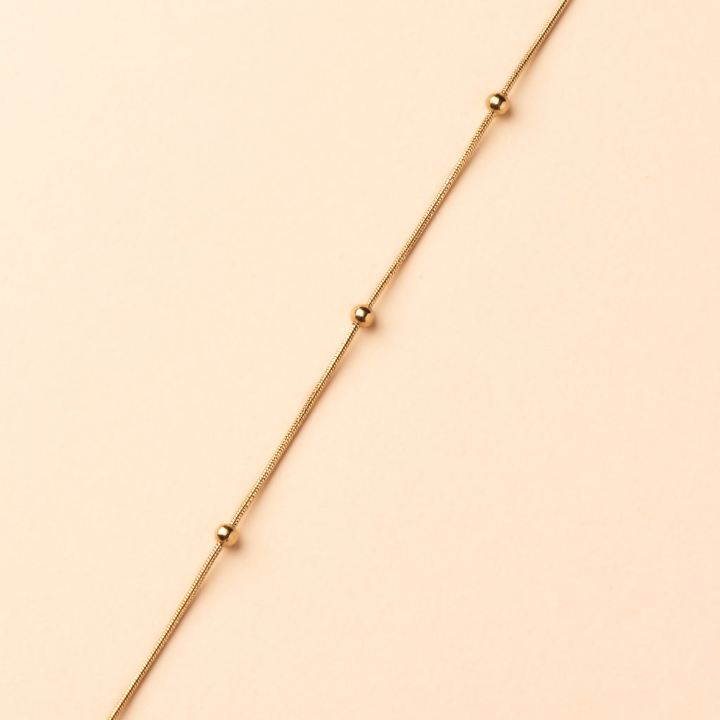 Collier avec billes or en acier inoxydable